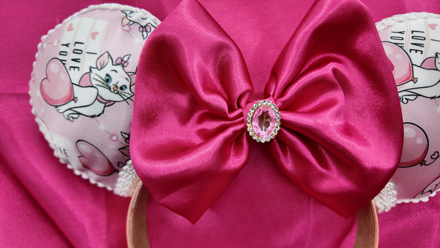 Marie Cat Ears Headband With Satin Bow Pink Featuring Adorable Cat Prints and Sparkling Rhinestone Center